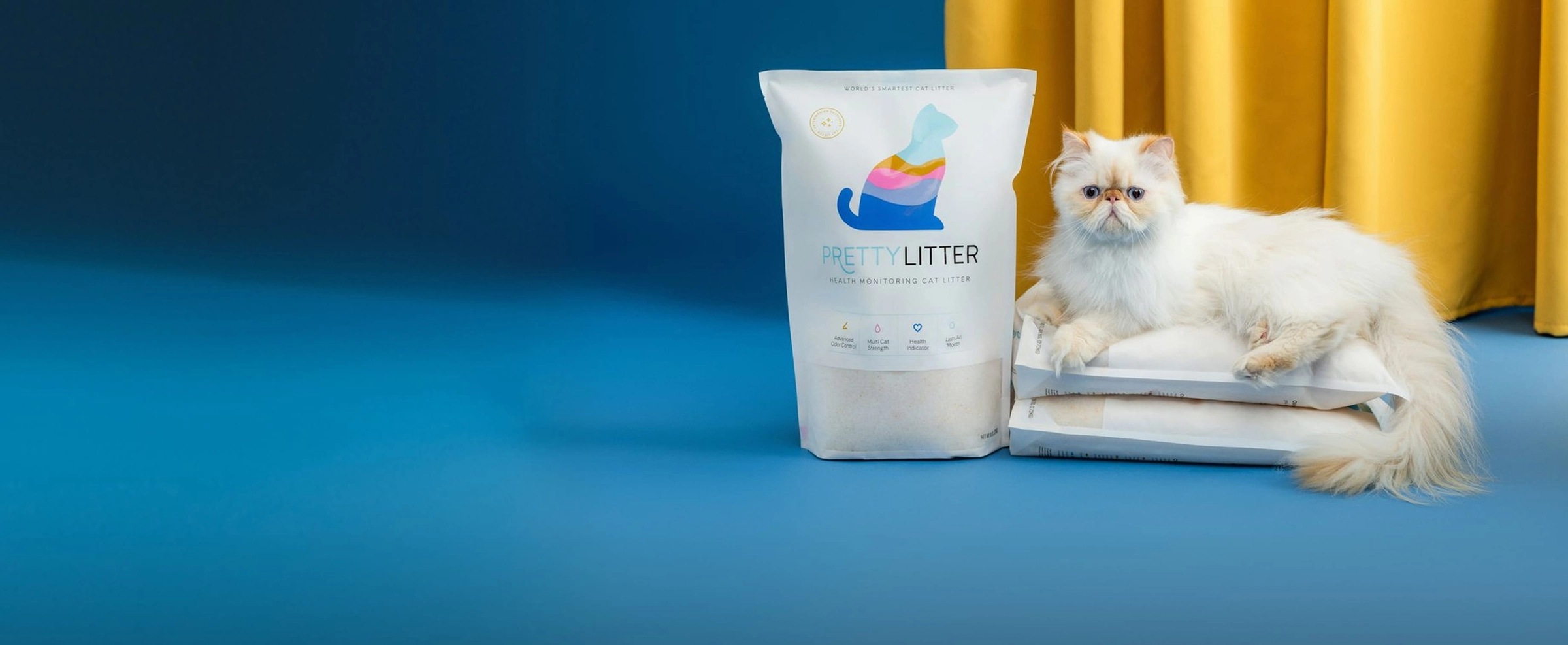 PrettyLitter bag next to a litter box